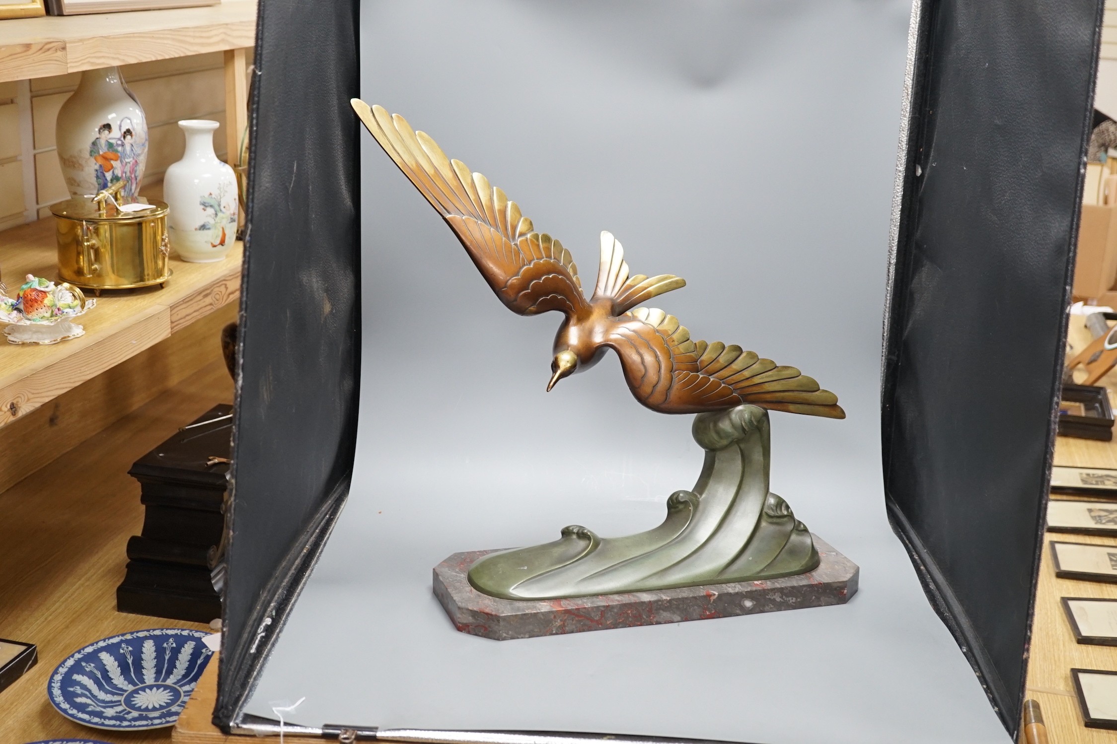 A large Art Deco bronze figure of a seabird, mounted on a marble base, signed Brault, 55.5 cms high
